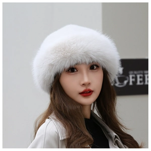 Close-up of thick white faux fur beret with soft fluffy texture for winter warmth