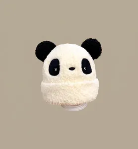 Detailed view of cream panda plush winter hat for kids with fluffy faux fur texture
