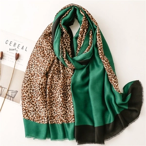 Elegant green satin and leopard print scarf with fringed edges and soft cotton-linen feel