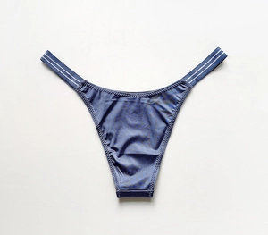 Detail of dark blue ice silk V-shaped underwear with silver-gray striped waist trim