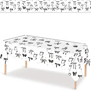 Detail of disposable tablecloth with black bows and stars pattern, 137x274cm size