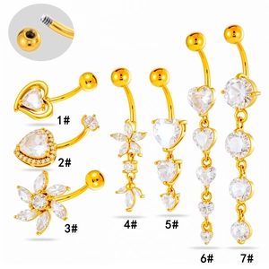 Set of 7 gold stainless steel navel rings with heart and flower cubic zirconia dangles