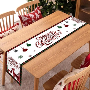 Christmas table runner with red reindeer and snowflakes on white fabric for holiday party