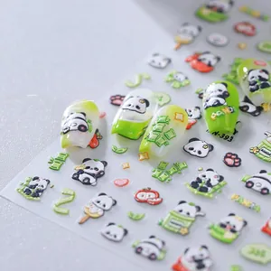 3D embossed panda nail stickers with bamboo and hearts shown on white and green nails