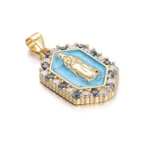 Macro detail of hexagonal gold pendant with blue enamel Virgin Mary and cubic zirconia
