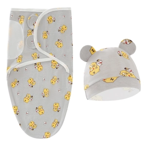 Detail of grey newborn swaddle sack and baby hat with yellow tiger print patterns