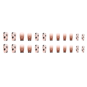 Gradient brown and nude press-on nails with minimalist black and white cow print design