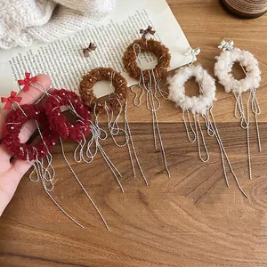 Winter plush wreath earrings with elegant silver chain tassels in red, brown and cream