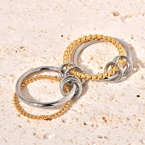 Interlocking two-tone twisted rope and beaded rings in 18k gold and silver steel