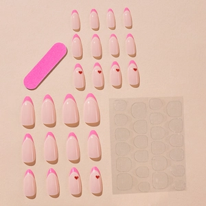 Pink French almond press-on nails with red heart patterns and nail application tool kit