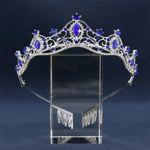 Detail of luxury bridal crown featuring deep blue crystals and silver filigree metalwork