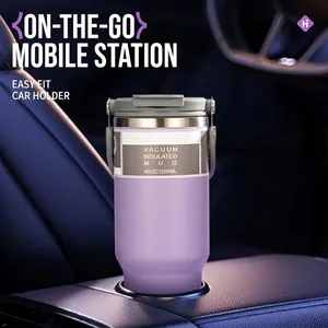 Purple 40oz stainless steel vacuum tumbler with handle fits in a car cup holder