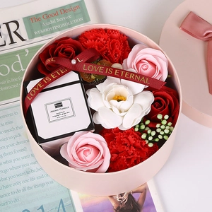 Pink round gift box with scented candle and soap roses with Love Is Eternal ribbon