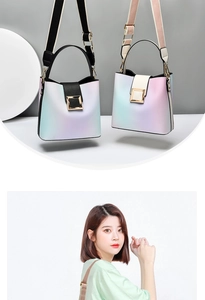 Detail of gradient bucket bags featuring golden metal buckles and wide shoulder straps