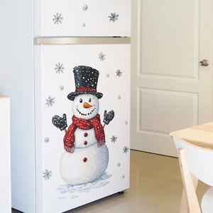 Christmas snowman wall sticker with black hat and red scarf on a white refrigerator