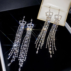 Detail of silver crown earrings with long cubic zirconia square fringe tassels