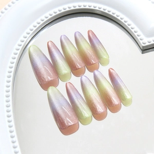 Cat eye almond press-on nails with rainbow gradient in purple, pink and green tones