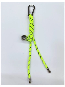 Detail of neon yellow braided cord keychain with silver metal ball and carabiner