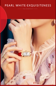 Elegant gold square watch with crystal inlay and red leather strap on model wrist