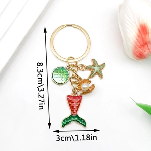 Detailed view of ocean theme keychain with starfish, shell and mermaid tail dimensions
