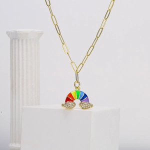 Gold paperclip chain necklace with a colorful enamel rainbow and zircon cloud pendant