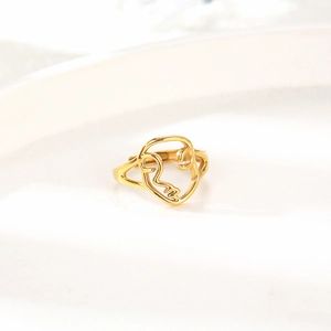 Minimalist gold stainless steel open ring with an artistic hollow abstract face design