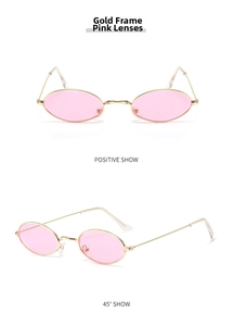 Detail of retro oval metal sunglasses with gold frame and translucent pink lenses