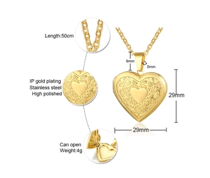 Detail view of heart locket pendant showing chain, embossed pattern, and internal structure