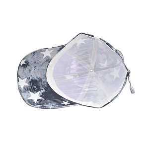 Detail of adjustable strap and white stitching on star print baseball cap interior