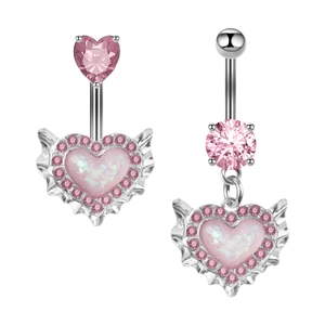 Detailed macro view of silver belly button rings with pink zircon and heart wing pendant