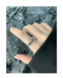 Detailed view of S925 silver ring with wrinkled texture and colorful zircon stones on hand