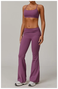 Detail of deep purple strapless yoga set featuring high-waist flared pants and sports bra