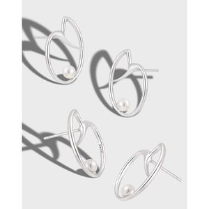 Irregular S925 sterling silver heart earrings with pearls in a modern minimalist design