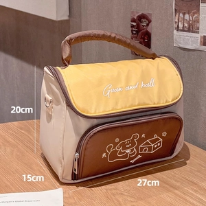Detail showing high-capacity makeup bag dimensions 27cm x 15cm x 20cm on wooden table