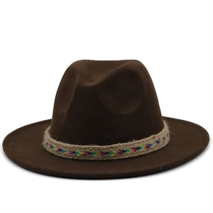 Dark brown wide brim wool fedora with rainbow woven rope band on white background