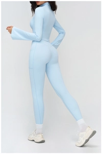 Detail view of light blue yoga set with high-waist leggings and stand collar jacket