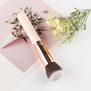 Flat top foundation brush with pink handle and rose gold ferrule for smooth blending
