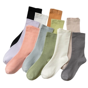Colorful set of pure cotton mid-calf socks in various soft pastel and neutral tones