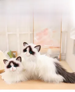 Detailed view of plush ragdoll cat dolls with soft long fur and blue realistic eyes