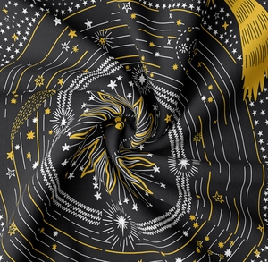 Close-up of black celestial tapestry with sun, stars and mystic astrological patterns