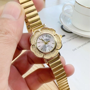 Vintage gold women's watch with flower-shaped case and elegant metal chain strap