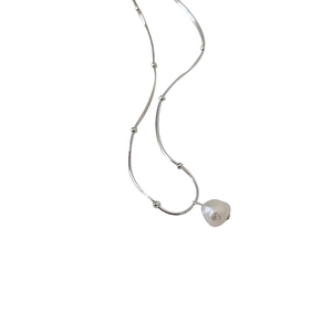 Elegant silver snake chain necklace with beaded accents and baroque pearl pendant