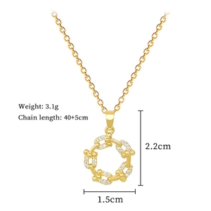 Detail view of gold titanium necklace showing dimensions 2.2cm pendant and 3.1g weight