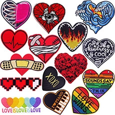 Close-up of 14-piece heart-shaped embroidered patch set with assorted creative designs