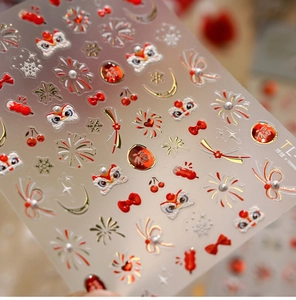 Macro view of 3D embossed nail stickers featuring festive Chinese lion and firework motifs