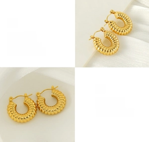 Detailed views of 18K gold plated C-shape spiral earrings with polished ribbed texture
