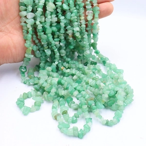 Close-up of natural irregular green stone beads for DIY handmade jewelry and bracelets