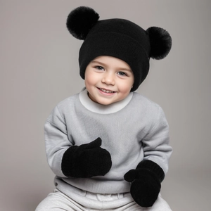 Cute black knit baby hat with double pom poms and matching gloves set for winter warmth