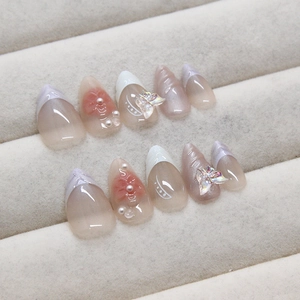 Press-on nails with 3D butterflies and pearls on gradient pink almond nails set