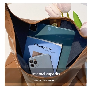 Macro view of the internal capacity and spacious leather interior for daily essentials